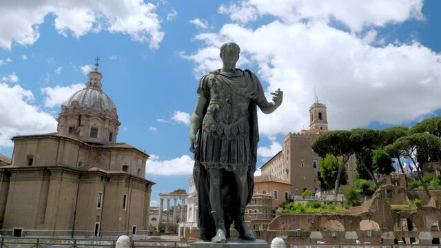 Bronze statue of emperor Julius Caesar along Via dei Fori Imperiali at the Roman Forum in Rome, Italy