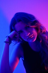 teenager in blue with neon ights