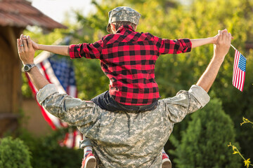  Happy reunion of soldier with family outdoors