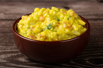 Bowl with guacamole on the table.