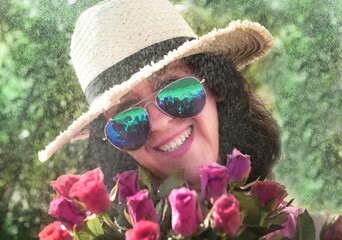 Happy woman with roses in sunglasses