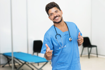 Motivated mexican male doctor is ready for vacinating patients