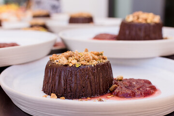 Chocolate Lava Cake with berry chutney and crumbled nut garnish
