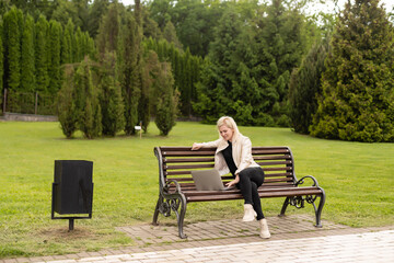 Image of elegant employer sitting on the bench