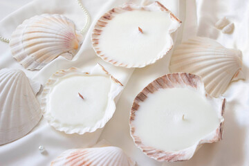 Candles shells rapan. Soy wax, wood and cotton wick. Cozy relaxing atmosphere. Hygge. Noble white color. Interior decor. Home, comfort.