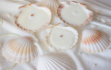 Candles shells rapan. Soy wax, wood and cotton wick. Cozy relaxing atmosphere. Hygge. Noble white color. Interior decor. Home, comfort.