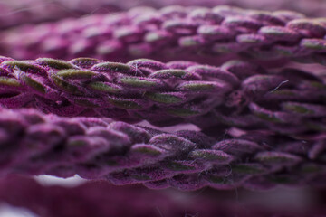 purple threads close up under the microscope background