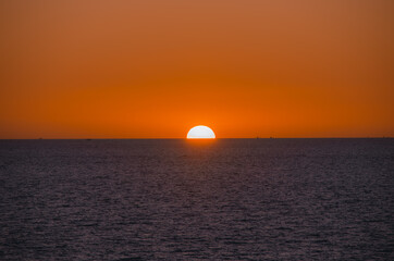 Beautiful sunset on the sea with soft focus and noise.
