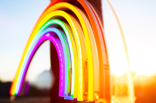 The led neon rainbow at the sunset