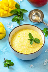 Ice cream, sweet snack or dessert. Homemade mango fruit ice cream, summer tropical fruit sorbet on a stone table.