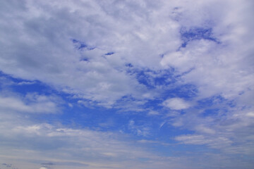 Light white clouds in the blue sky