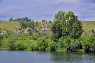 Fototapeta na wymiar Under the mountain, near the village of Chuviryata, the river Sylva flows