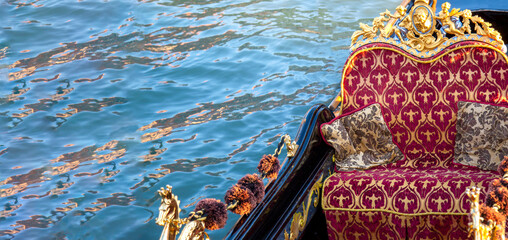 Luxury Gondola waiting for tourists near famous Rialto Bridge in Venice. © eskystudio