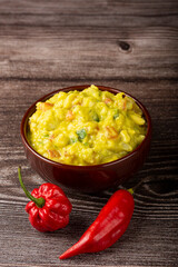 Bowl with guacamole on the table.