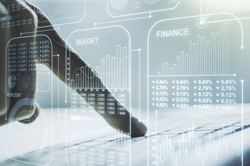 Multi exposure of stats data illustration with hands typing on computer keyboard on background, computing and analytics concept