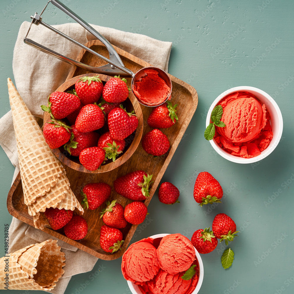 Aufkleber strawberry sorbet with strawberries on blue background with copy space. heap of strawberry with ice 