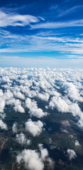 Aerial view of clouds over green areas