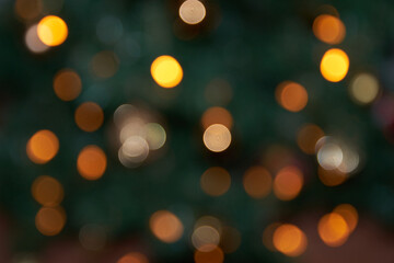 Fototapeta premium yellow orange circles on dark green background new year background glare Night lights at a festival