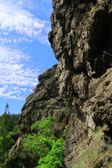 rock in the mountains with a rock climber at the horizon