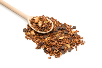 Chocolate granola cereal with nuts in a wooden spoon.