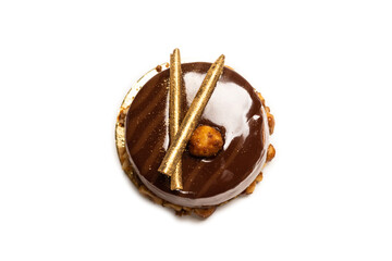 Chocolate and caramel cake isolated on a white background.