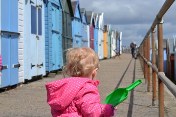little girl with beach huts 