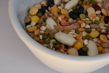 close-up of a cup of legumes ready for soup