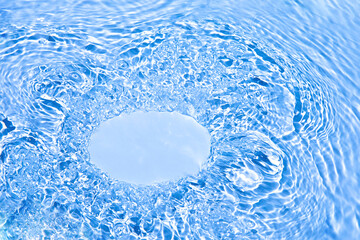 Transparent blue colored clear water surface texture with ripples, splashes and bubbles. Nature...