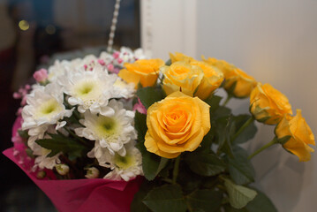 bouquet of yellow roses and white flowers
