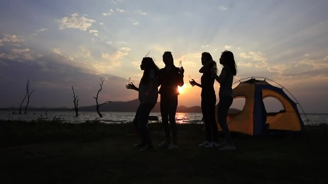  Happy and Funny Teenage tourist dring and dance at front of camping tent during set set 