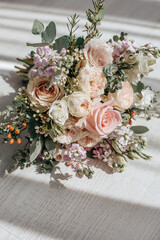Wedding bouquet of peonies flowers on the floor of the newlyweds