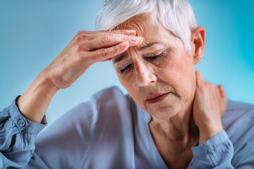 Senior Woman with Intense Migraine Headache Pain.