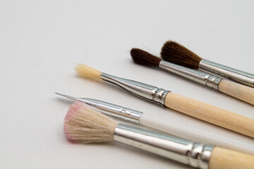 Brushes for makeup and manicure. Stylist. Beauty and fashion. Background for the designer.
