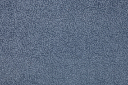 The background image is gray leather with an abstract texture