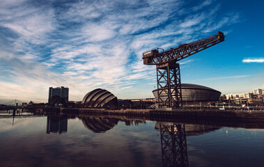 GLASGOW, SCOTLAND - JUNE 2021: the Hydro Arena and Finnieston crane reflecting on the River Clyde...