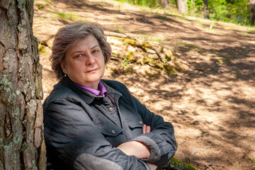 The cheerful mature woman smiled at the photographer.