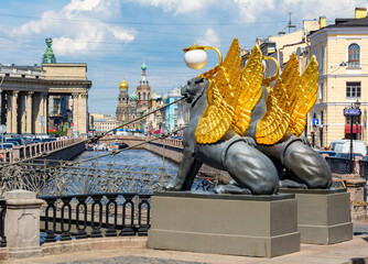 Bank bridge with golden-winged griffons over Griboyedov canal, Saint Petersburg, Russia (inscription 