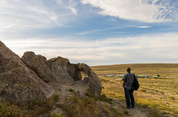 Obraz premium Panoramic spring landscape along the I-80 highway in Utah. A tourist walking on the trail
