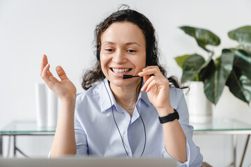 Front view portrait of a video call of mature middle-aged businesswoman IT support hot line worker on conversation online. Female tutor teacher lecturer conducting lessons remotely - obrazy, fototapety, plakaty