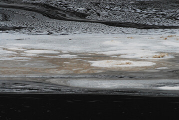 ABSTRACT- A Beautiful View of Foam Patterns on a Dark River