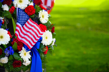 A beautiful wreath of flowers and a flag on Memorial Day