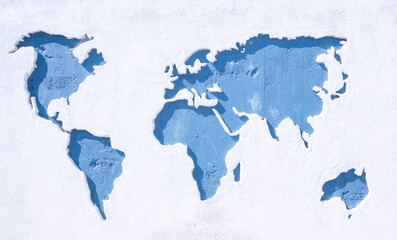 mapa  do mundo em relevo numa parede de cimento.