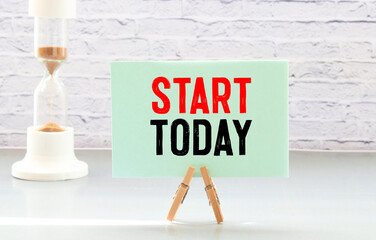 Get started today - text on a vintage slate blackboard - motivation concept.