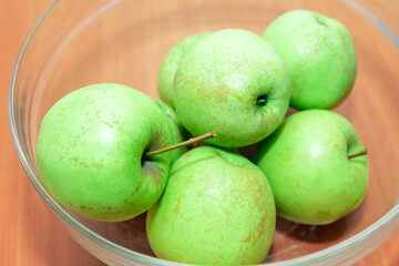 Golden Delicious Apples in the Glass Bowl . Healthy fruits for everyday eating