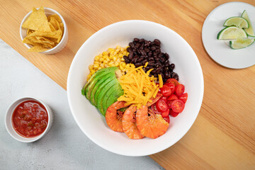 Shrimp burrito bowl with chips and salsa