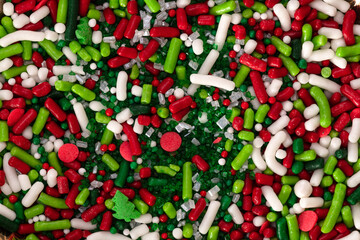 Background texture of red, green and white Christmas candy sprinkles.