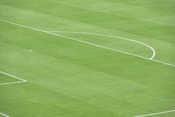 Green football field with nobody