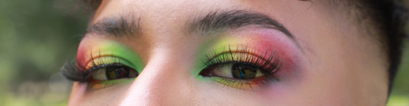 LGBT Gay model close up to rainbow makeup 
