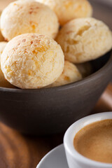 CHEESE BREAD WITH ESPRESSO COFFEE ON A WOODEN TABLE