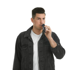 Man blowing into breathalyzer on white background